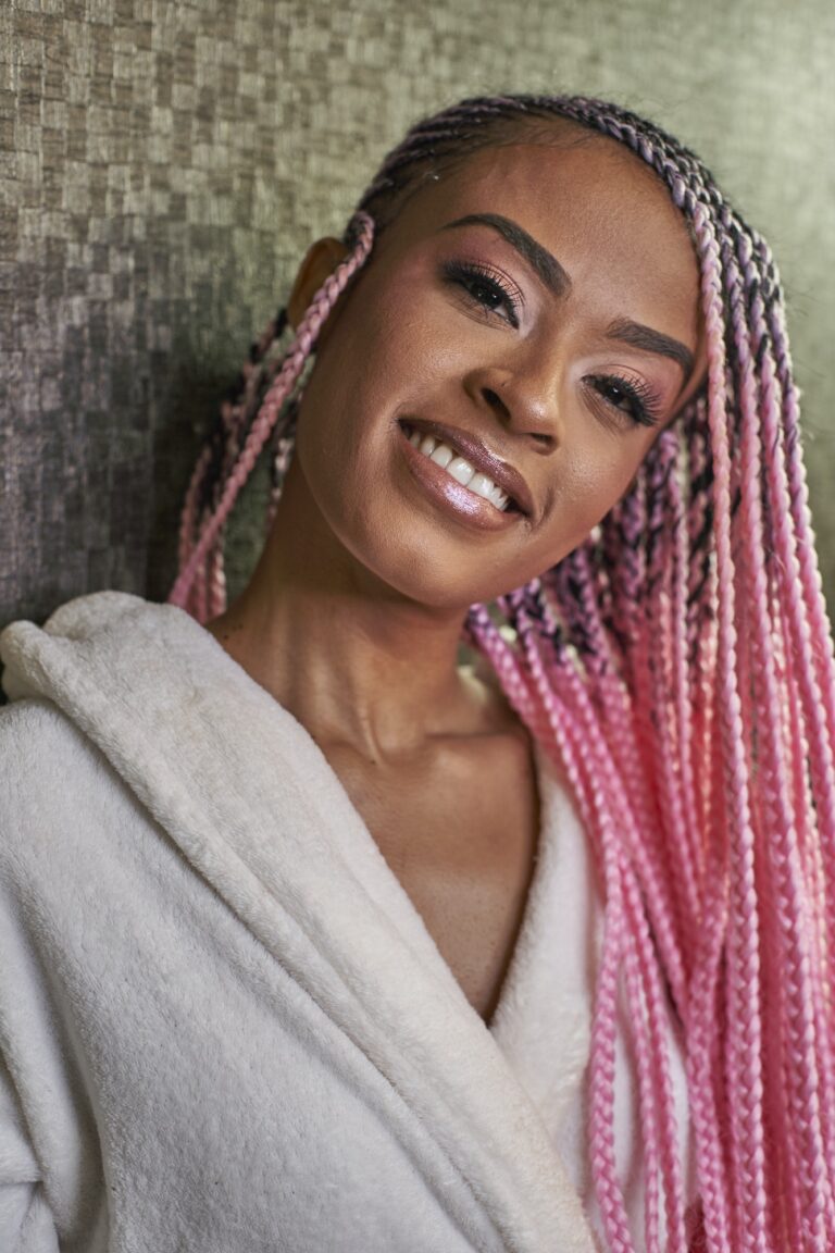 Portrait of young woman with pink braids